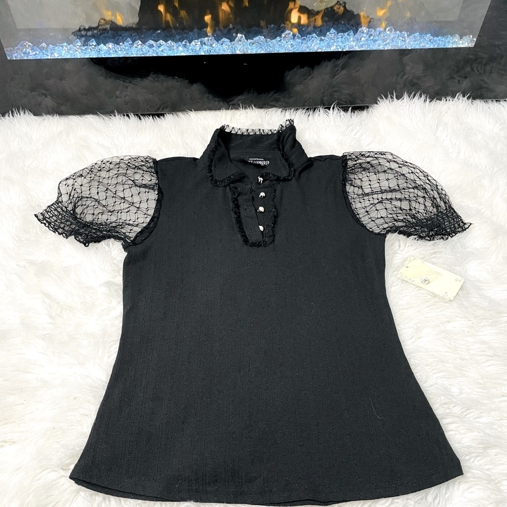 Women top, black W/white pearl buttons